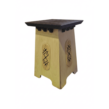 A small, light-colored wooden table with a darker square top. The base is tapered and features decorative, carved inserts on its sides, along with small corbel-like details beneath the tabletop. — 3D model (AI enhanced source)