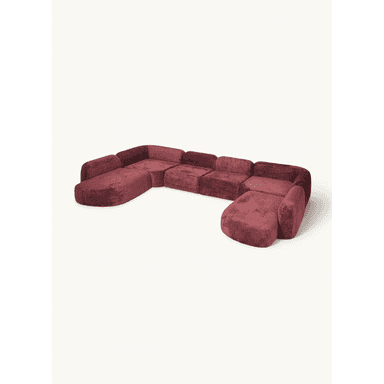 A modular sectional sofa with a U-shaped configuration. It features plush upholstery and rounded armrests and edges. The configuration consists of multiple connected seating modules, including corner pieces and possibly chaise elements, forming a large seating arrangement. — 3D model (AI enhanced source)