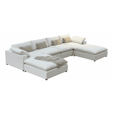 A modular sectional sofa with multiple seating components arranged in a U-shape. It features a low profile, deep seating, and ample cushioning. The sofa is upholstered in a white material and comes with several throw pillows in neutral tones. A beige knitted throw is draped over one of the chaise sections. — 3D model (AI enhanced source)