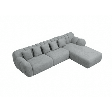 A modern light grey fabric sectional sofa featuring a modular design with a prominent chaise lounge on the right. The backrest and armrests exhibit distinctive channel tufting, creating a plush and rounded aesthetic. Four matching throw pillows are included. The sofa has a low-profile, inviting appearance. — 3D model (AI enhanced source)