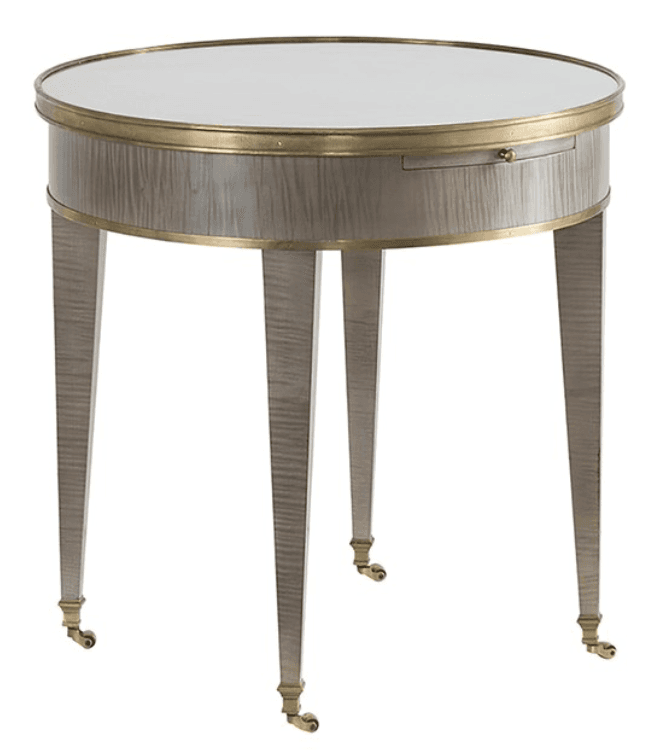 A round accent table in a Neoclassical or French-inspired style, featuring a mirrored top surface, brass banding, light gray cerused wood finish, tapered legs, and brass casters. — 3D model