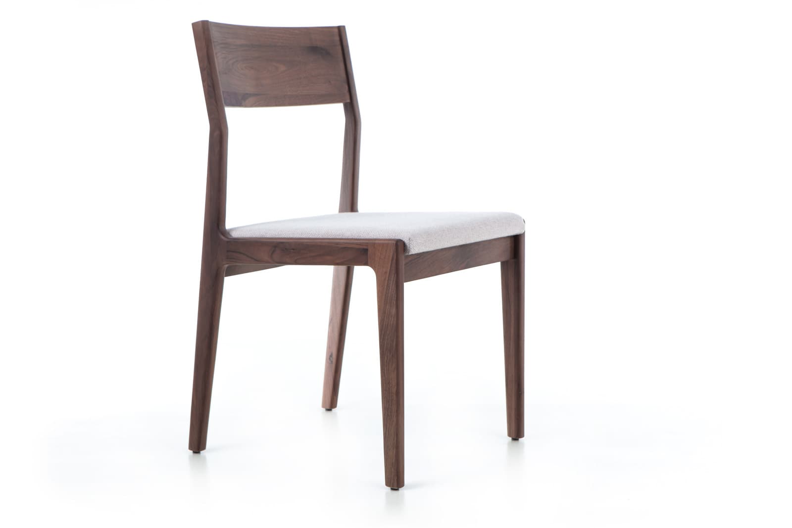 A wooden dining chair with a lightly upholstered seat and a slatted backrest. The chair features tapered legs and a minimalist design. — 3D model
