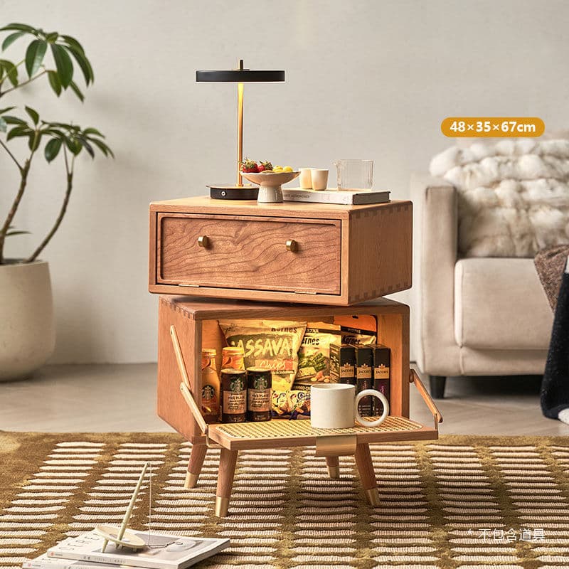 A wooden nightstand with a single drawer and an open compartment below. The drawer has two brass knobs. The lower compartment features a drop-down door with a cane-woven inset and a brass pull handle. The nightstand is supported by four tapered legs with brass accents at the base. — 3D model
