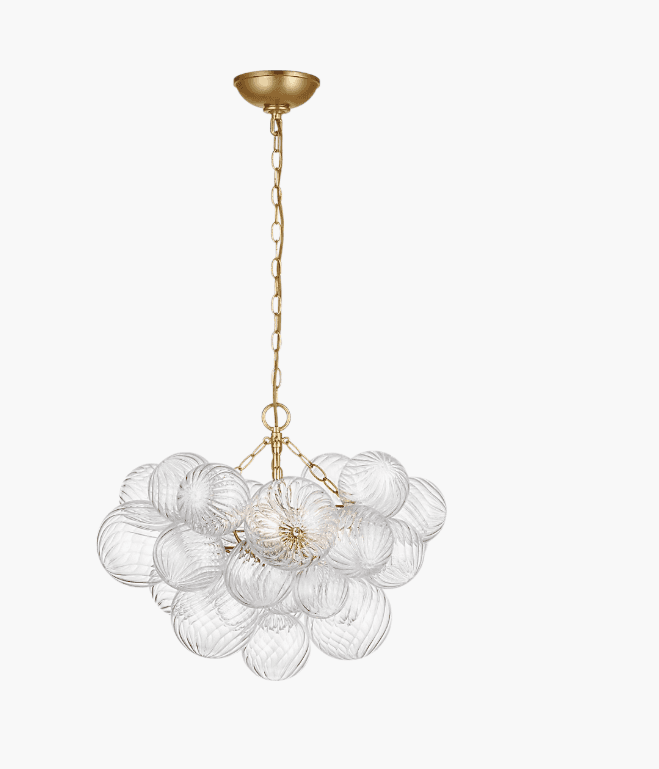 A contemporary chandelier featuring a cluster of clear, textured glass orbs suspended by a gold-fini… — 3D model