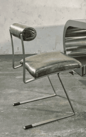 A modern dining chair with a cantilever base. The seat and backrest are upholstered in a dark olive-… — 3D model