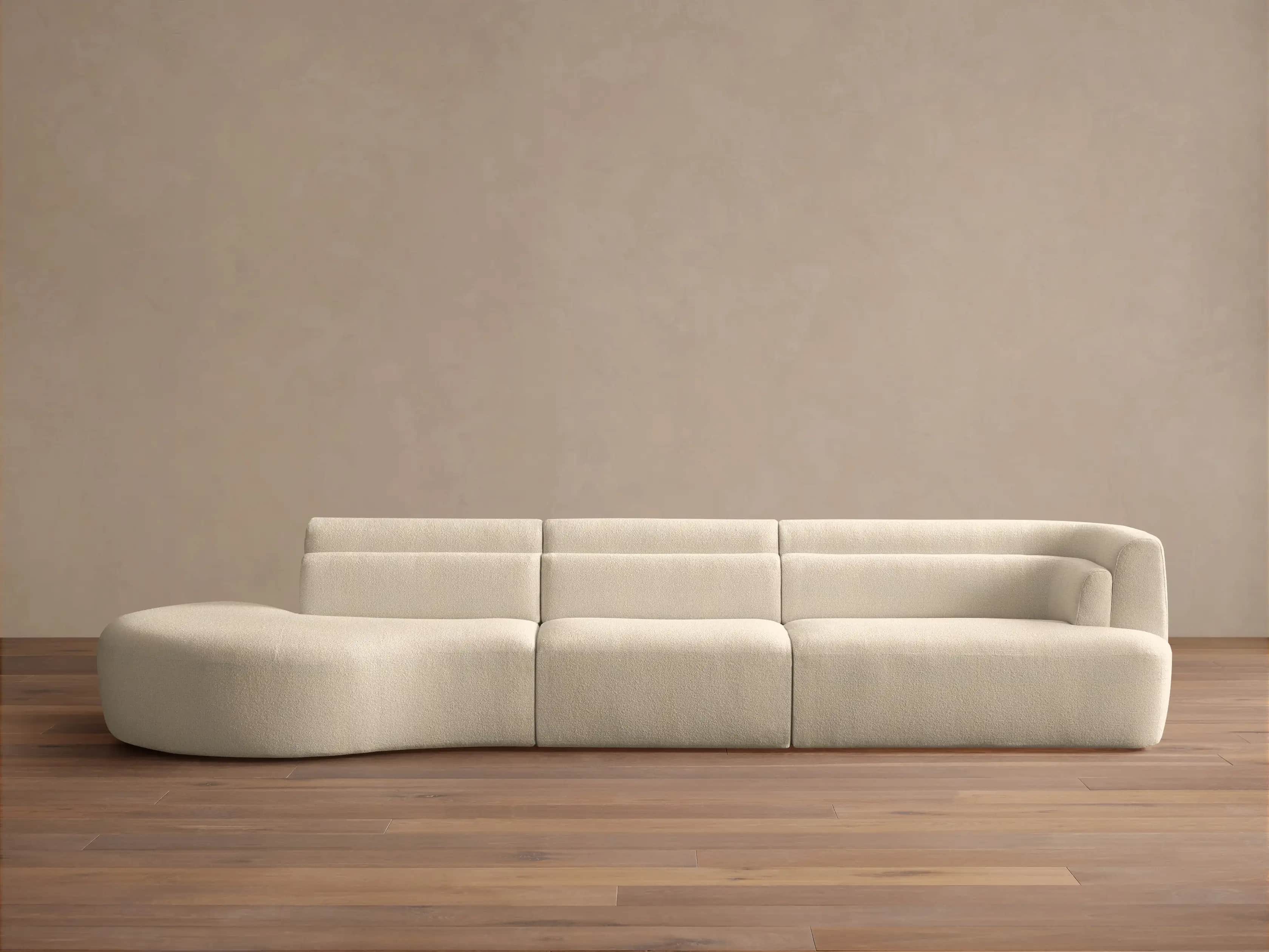 A modular sofa with a rounded chaise lounge on the left side. The sofa features a soft, textured fab… — free FBX 3D model