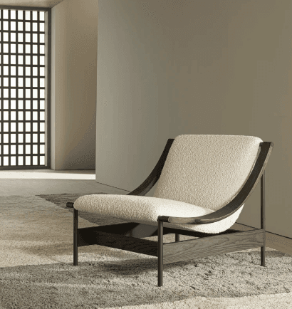 A modern lounge chair featuring a dark-stained solid wood frame and plush, off-white bouclé fabric upholstery. The design emphasizes clean lines and natural textures, with a low profile for relaxed seating. — 3D model