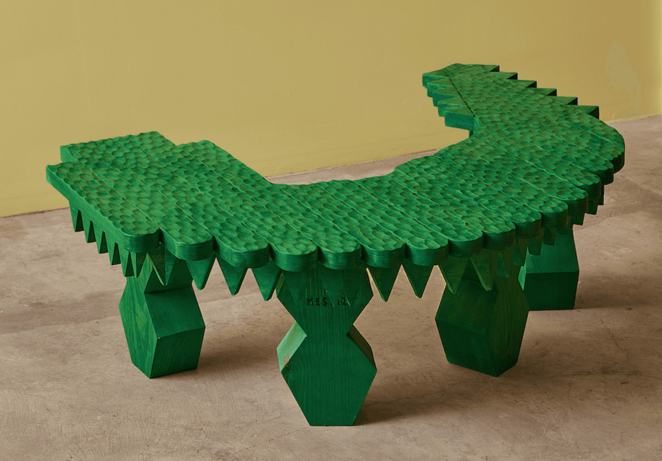 A vibrant green, elaborately carved low bench, shaped with an undulating profile reminiscent of a crocodile or dragon. The top surface is textured with a scale-like pattern, and the edges feature sharp, jagged protrusions. The bench is supported by chunky, faceted legs, all finished in the same bright green color. — 3D model