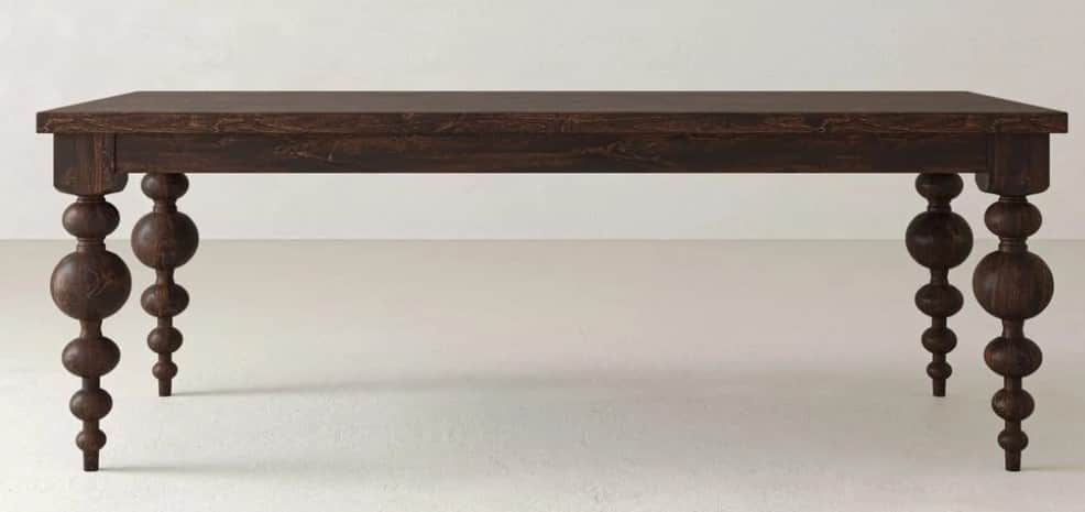 A rectangular dining table crafted from dark-stained wood, featuring a thick tabletop and a deep apr… — 3D model