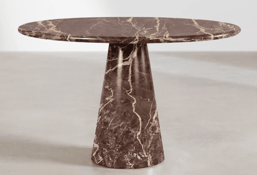A pedestal table with a round, flat top and a single, tapered pedestal base. The surface exhibits a marbled pattern. — 3D model