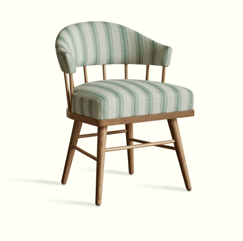 An accent chair with a wooden frame and upholstered seat and back. The chair features a curved backr… — 3D model