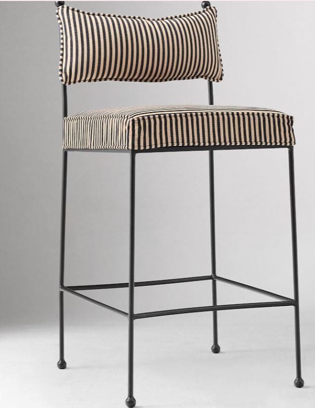 A tall, contemporary bar stool featuring a minimalist black metal frame, an upholstered seat, and a separate upholstered backrest. Both the seat and backrest cushions are covered in a fabric with distinct vertical black and off-white stripes. The slender metal legs include a square footrest and terminate with small spherical feet. — 3D model