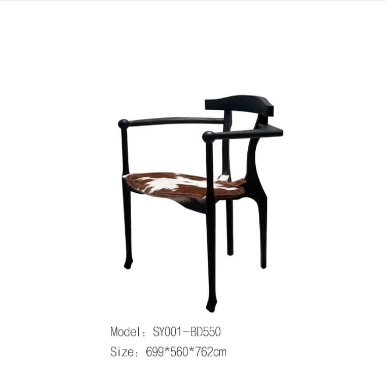 A black armchair with a unique, sculpted frame. The seat is upholstered with what appears to be a cowhide material, featuring patches of brown and white. The chair has a distinctive silhouette with curved armrests and a high back with horizontal elements. — 3D model
