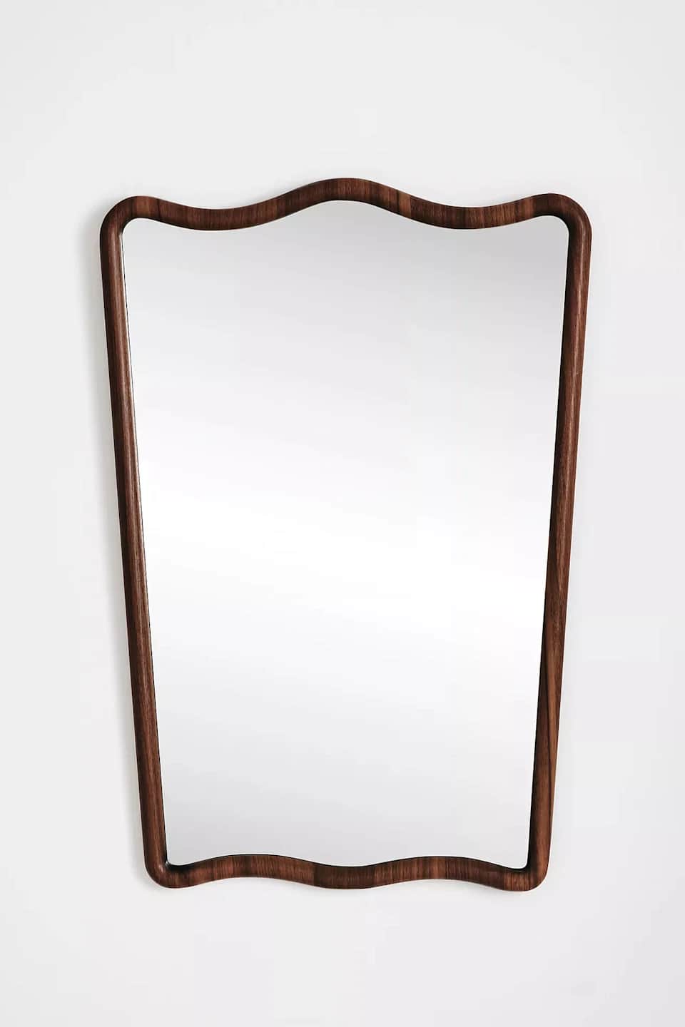 A rectangular wall mirror featuring a distinctive wavy, organic-shaped frame made from dark brown wo… — 3D model
