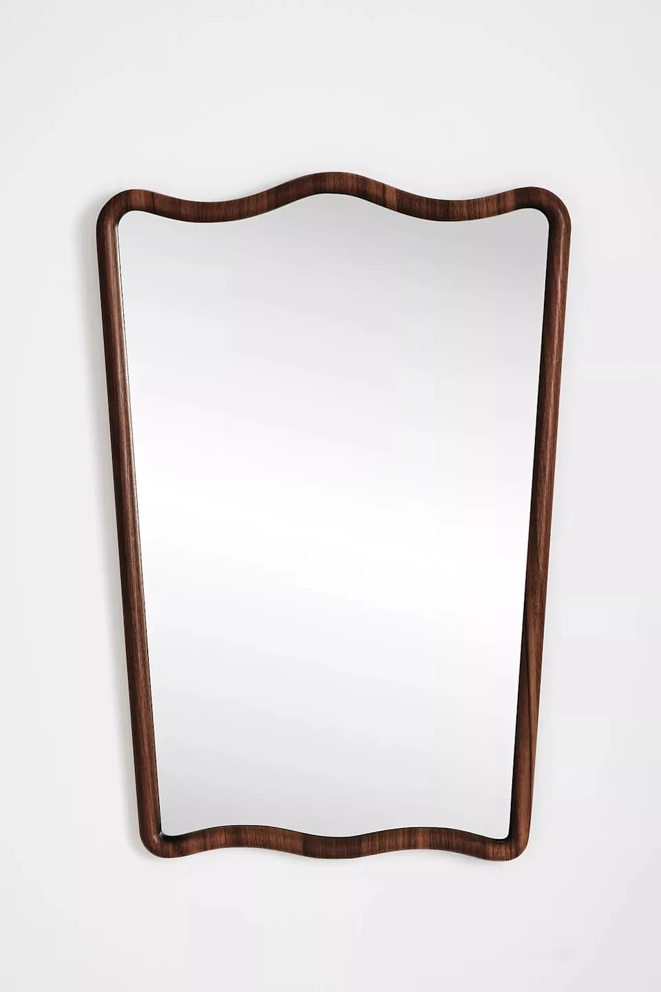 A rectangular wall mirror featuring a distinctive wavy, organic-shaped frame made from dark brown wood. The frame has smooth, rounded edges and encases a clear reflective glass surface. — 3D model