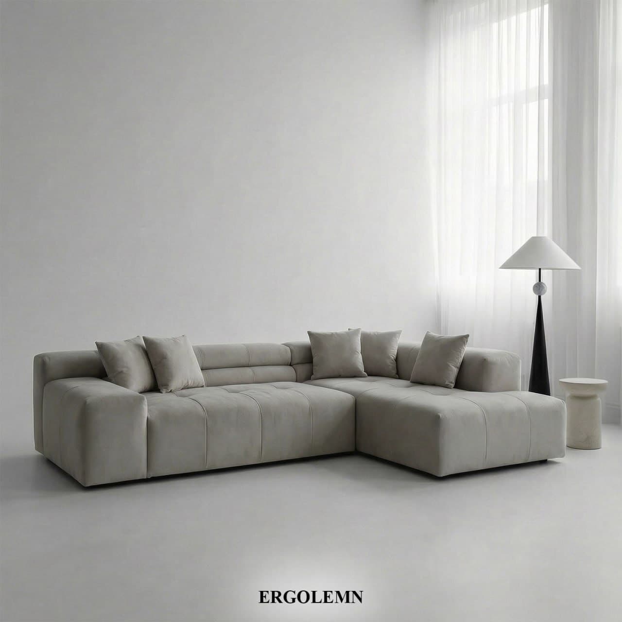 A light gray modular L-shaped sectional sofa with deep button tufting and loose back cushions, featuring a contemporary, minimalist design. — 3D model