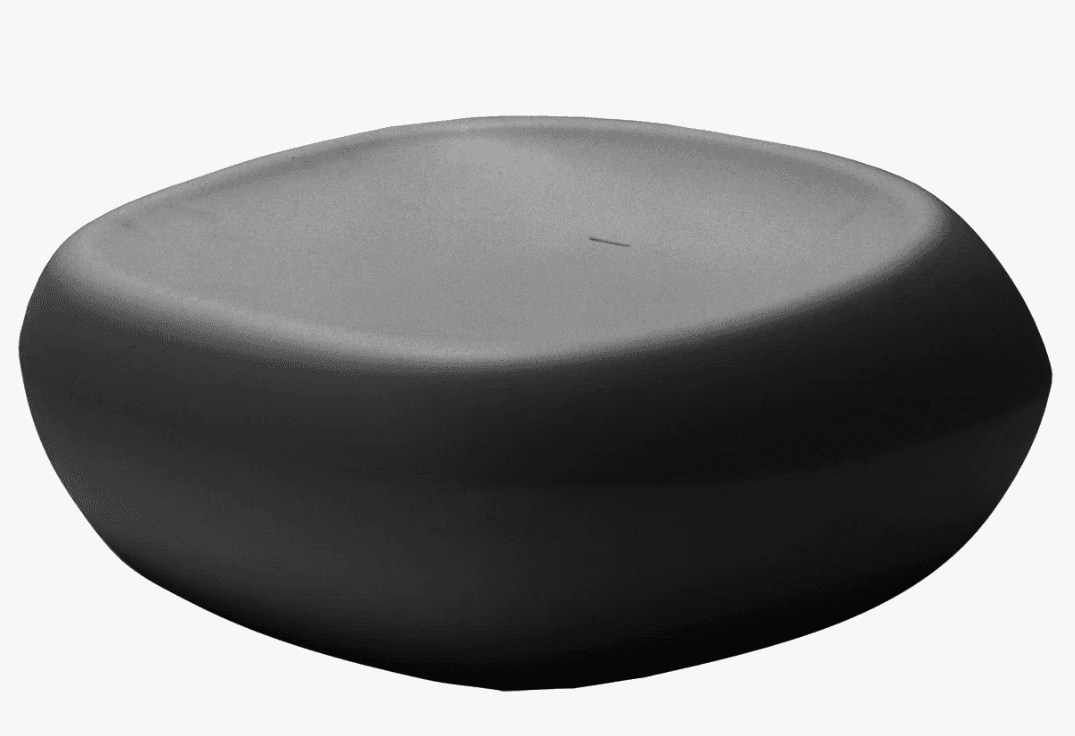 A modern, low-profile stool with an organic, rounded, pebble-like shape. It features a smooth, matte dark gray surface and appears to be constructed from a single molded piece. The top surface is slightly concave. — 3D model