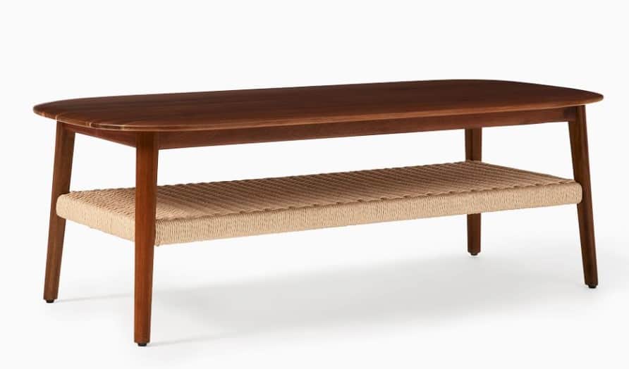 A mid-century modern coffee table featuring a rectangular, dark wood top with rounded corners. It is… — 3D model