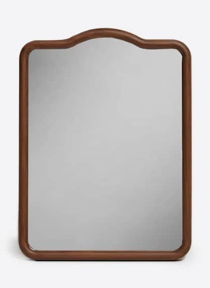 A rectangular mirror with a decorative curved top edge and rounded corners. It is framed by a substa… — 3D model