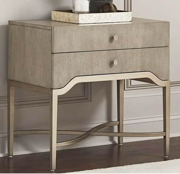 A two-drawer nightstand with a light wood grain finish on the drawers and a metallic base. The base… — 3D model