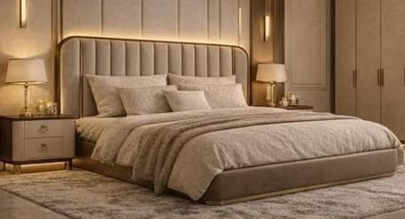 A modern upholstered platform bed featuring a tall, rectangular headboard with vertical channel tufting. The headboard and bed frame are covered in a light beige or taupe fabric. A sleek, golden-finished metal frame outlines the headboard and sides of the bed, providing a luxurious accent. The bed is furnished with a mattress, pillows, and a duvet in coordinating neutral tones. — 3D model