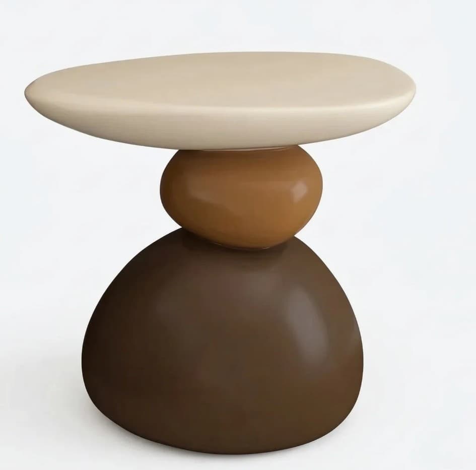 A contemporary side table with a sculptural design, resembling stacked stones. It features an oval-shaped top and a base constructed from three rounded, organically shaped elements stacked vertically. The surface is smooth and glossy. — 3D model