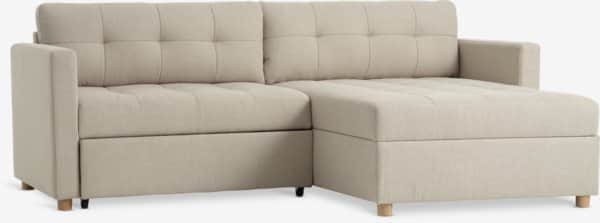 A light beige sectional sofa featuring a chaise lounge on the right side and a pull-out sleeper mech… — 3D model