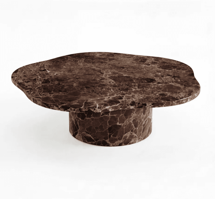 A low-profile coffee table constructed entirely from dark brown marble with striking lighter veining. The tabletop features an irregular, organic shape, giving it a natural, sculptural quality. It rests upon a robust, cylindrical pedestal base, also crafted from the same veined marble, creating a monolithic and cohesive appearance. The table exhibits a modern, contemporary aesthetic. — 3D model