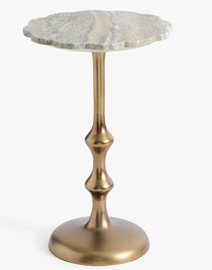 A small, decorative end table with a uniquely shaped top and a sculpted pedestal base. The tabletop appears to be made of natural stone with visible banding and texture. The base is slender and features bulbous, decorative elements, rising from a wide, circular foot. The overall design suggests a blend of natural material and metallic elegance. — 3D model
