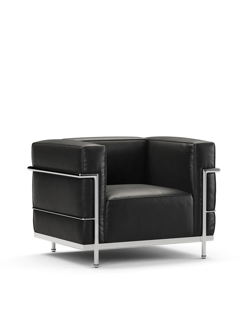 A modern armchair with a cubic silhouette, upholstered in black leather and supported by a polished chrome frame. The frame forms the arms and legs, providing a minimalist aesthetic. The seat and back cushions are distinct and appear to be generously padded. — 3D model