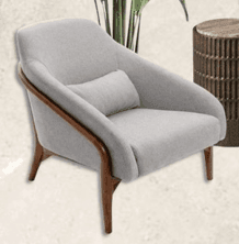 A light gray upholstered lounge chair featuring a prominent exposed wooden frame that curves to form the armrests and extends into the splayed legs. The chair includes a small, loose lumbar support pillow. — 3D model