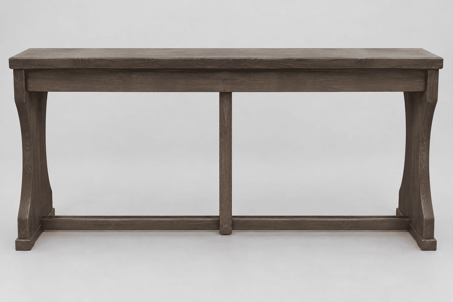 A sturdy, rectangular bench constructed from dark-stained solid wood. It features a thick, flat top surface. The base consists of two substantial, slightly curved end supports that taper inwards towards the bottom, connected by a long horizontal stretcher near the floor. A central vertical support connects this stretcher to the underside of the bench top, providing additional stability. The wood grain is visible throughout the dark finish. — 3D model