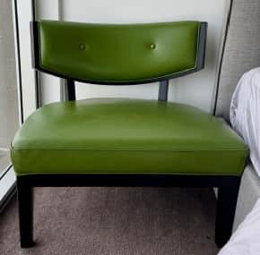 An armless accent chair featuring a low-profile design with a padded seat and a gently curved backre… — free OBJ 3D model