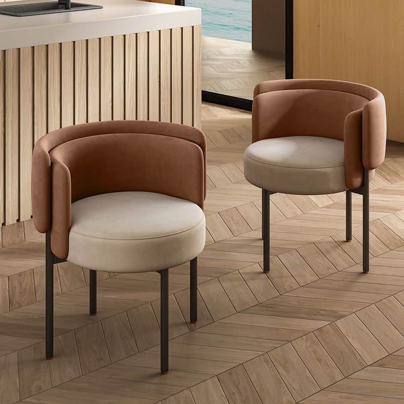 A contemporary accent chair featuring a rounded, enveloping backrest and seat, upholstered in contra… — 3D model