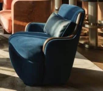 A contemporary armchair with deep blue fabric upholstery and a distinctive curved exposed wood frame… — free OBJ 3D model