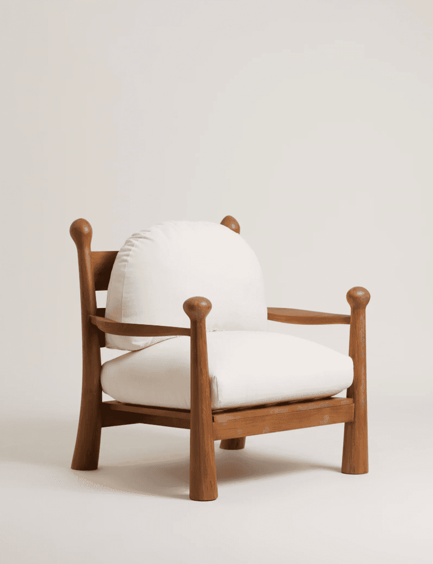A contemporary lounge armchair featuring a robust, light-toned wooden frame and thick, off-white uph… — free OBJ 3D model