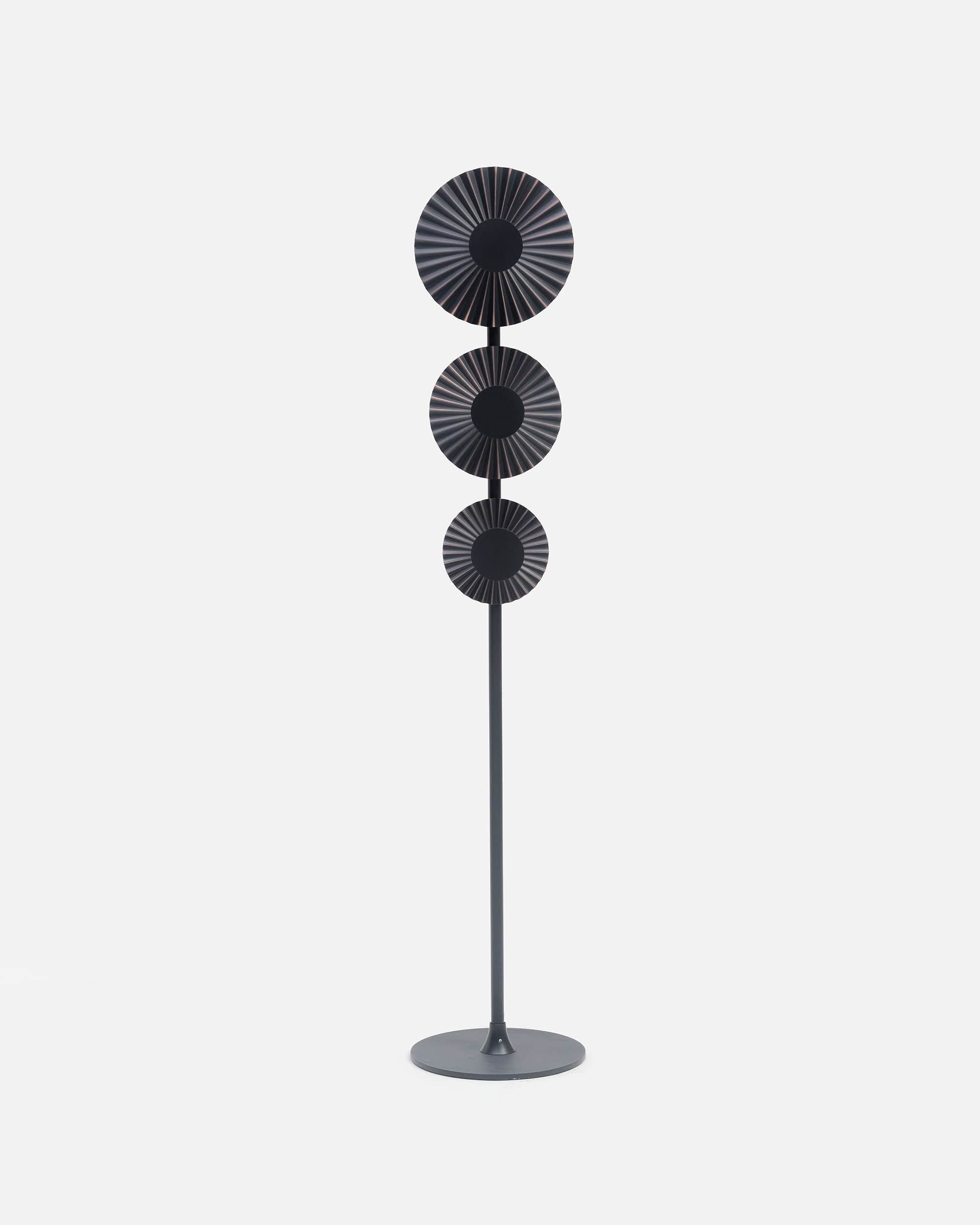 A tall, contemporary floor lamp featuring a round base, a slender central pole, and three circular,… — 3D model