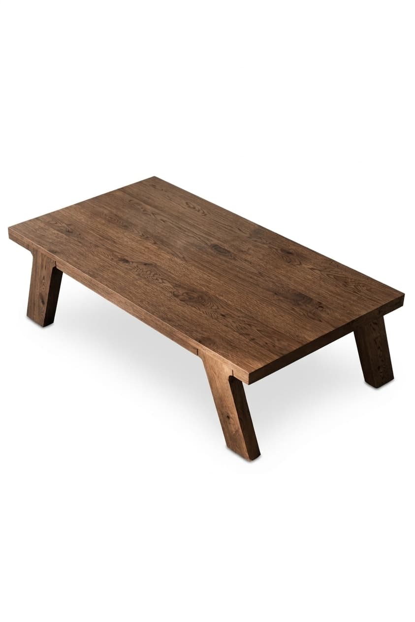 A low-profile rectangular coffee table crafted from dark brown wood, featuring a thick, solid tabletop and two angled, block-style legs providing stable support. The wood displays a prominent grain pattern. — 3D model