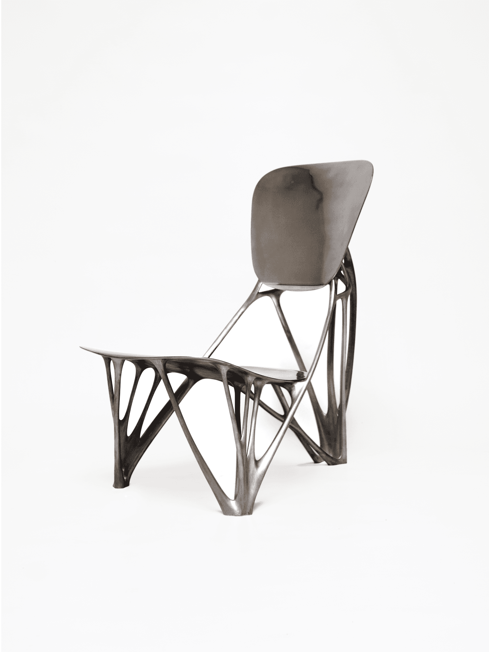 A contemporary chair featuring an intricate, dark-colored biomorphic skeletal base that supports a smoothly contoured, matte grey seat and backrest. The design is sculptural and avant-garde. — 3D model