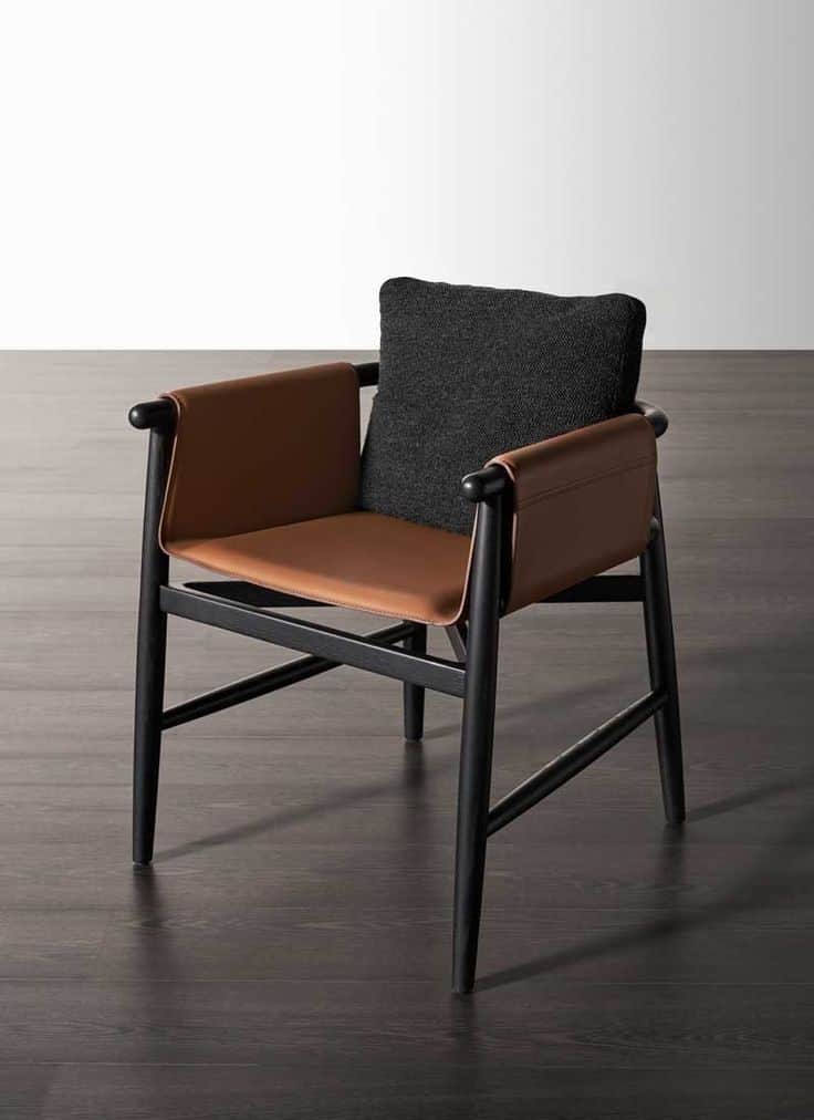 A contemporary armchair featuring a dark-stained solid wood frame, tan leather sling seat and armres… — free OBJ 3D model