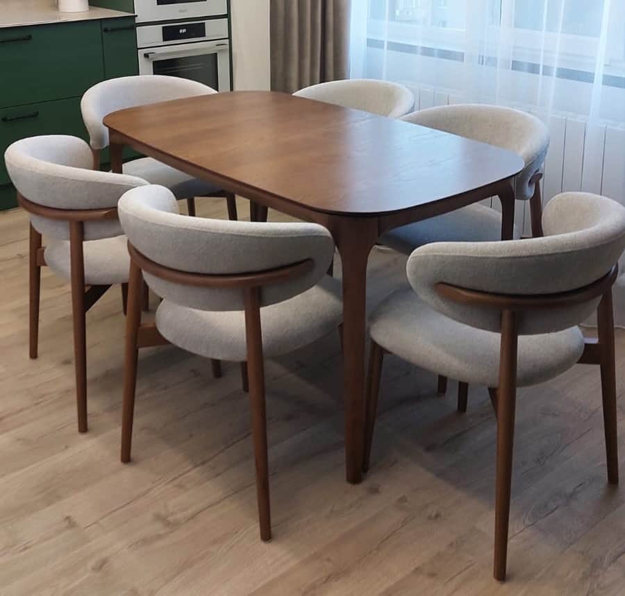 A complete modern dining set comprising a rectangular dining table with rounded corners and six matc… — 3D model