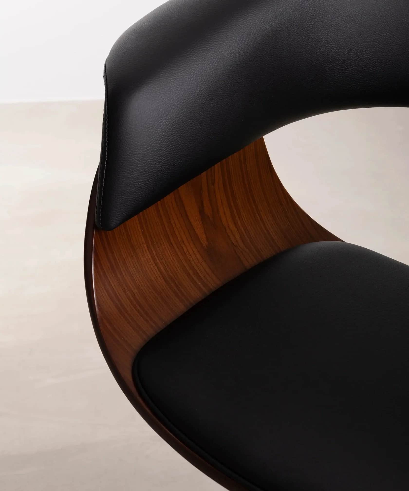 A close-up view of a lounge chair, highlighting its curved bentwood frame in a rich brown finish and… — 3D model