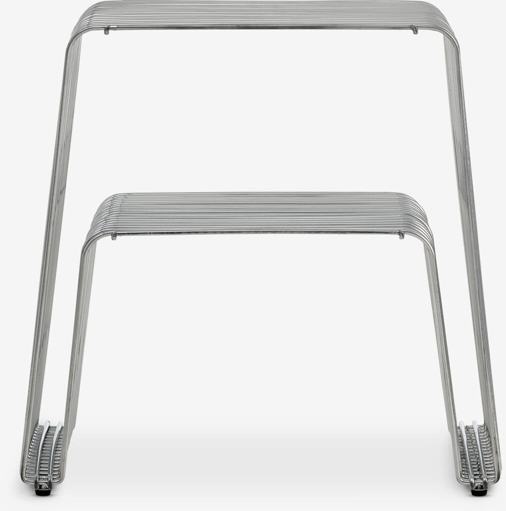 A modern chair constructed from bent metal rods. It features a minimalist design with parallel rods forming the seat and backrest, supported by a U-shaped frame. The legs also consist of bent metal rods, with a coiled design at the base. — 3D model