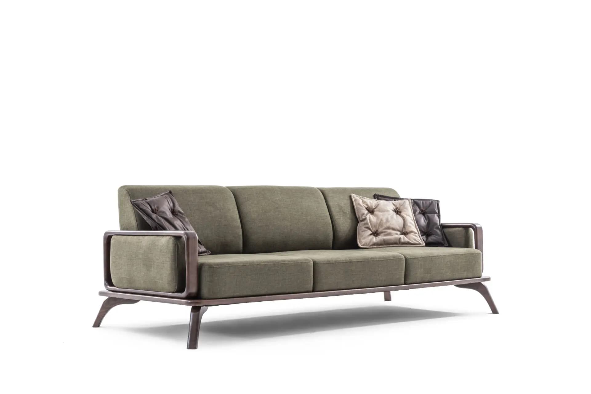A modern three-seater sofa featuring an exposed dark wood frame and olive green fabric upholstery. It includes three individual seat cushions and three back cushions, accompanied by several smaller accent pillows, some of which are tufted. The distinctive open armrests are integrated into the frame, which extends to form tapered, angled legs. — 3D model