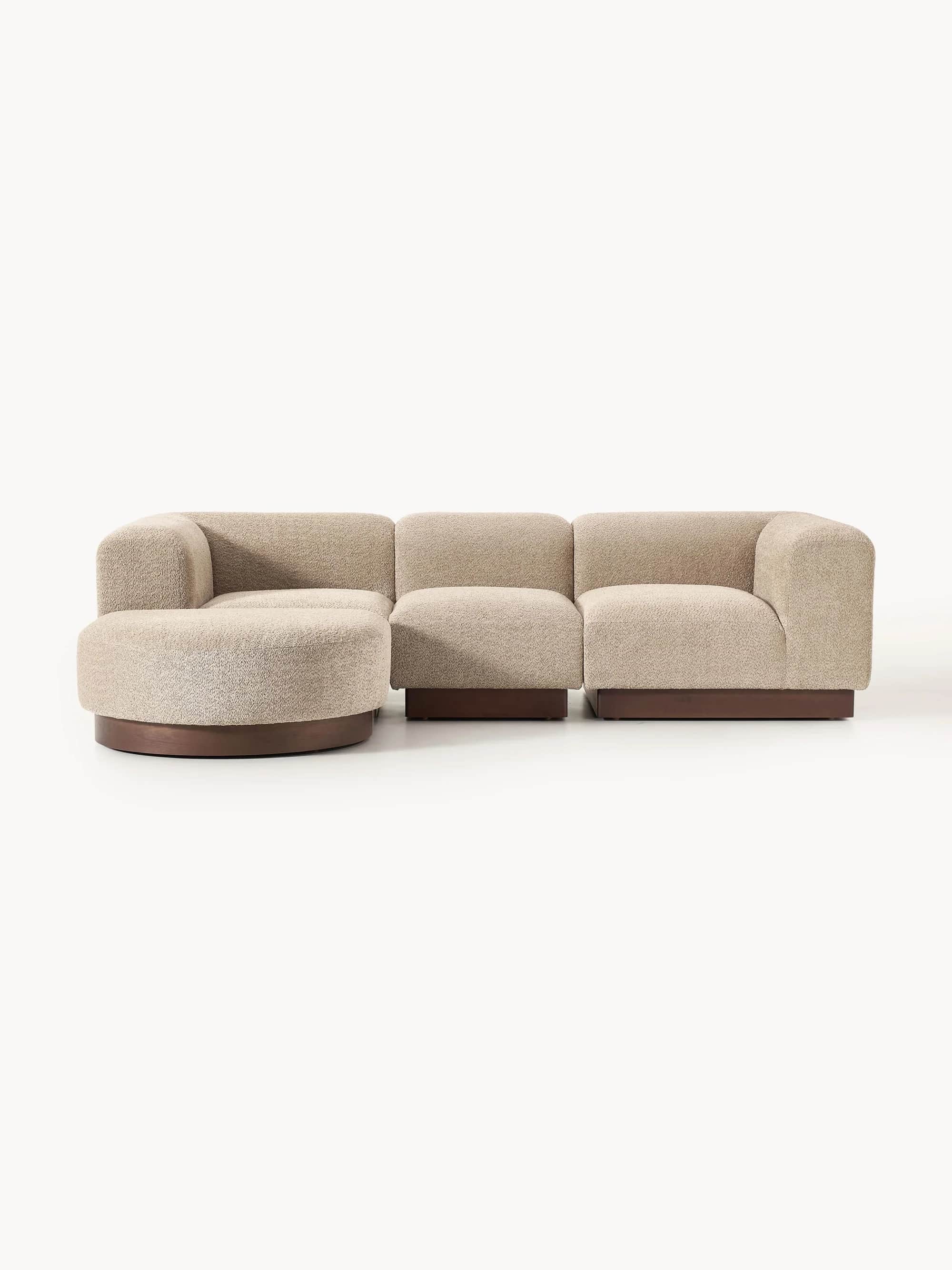 A sectional sofa composed of three distinct modules, including a curved corner piece, an armless cen… — free GLTF 3D model