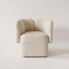 A modern armchair with a rounded, compact design. The chair features a cubic seat base and two curve… — free OBJ 3D model