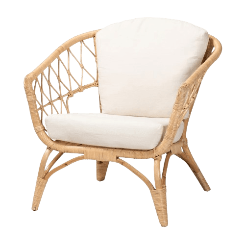 A natural rattan armchair with a curved back and armrests. It features a woven cane pattern on the sides and back, supported by curved legs. The chair is equipped with thick, cream-colored seat and back cushions. — 3D model