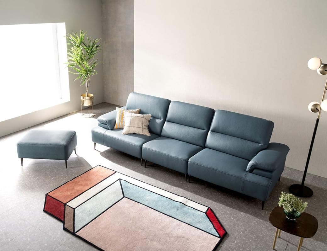 A modern, multi-segment sectional sofa upholstered in a blue-grey leather or high-quality faux leather. The sofa features a chaise lounge on the left side (from the viewer's perspective) and two additional seating segments. Each back cushion appears to have an adjustable headrest mechanism, visible by the segmented padding. The armrests are wide and plush. The entire sofa is supported by slender, black, tapered metal legs. — 3D model