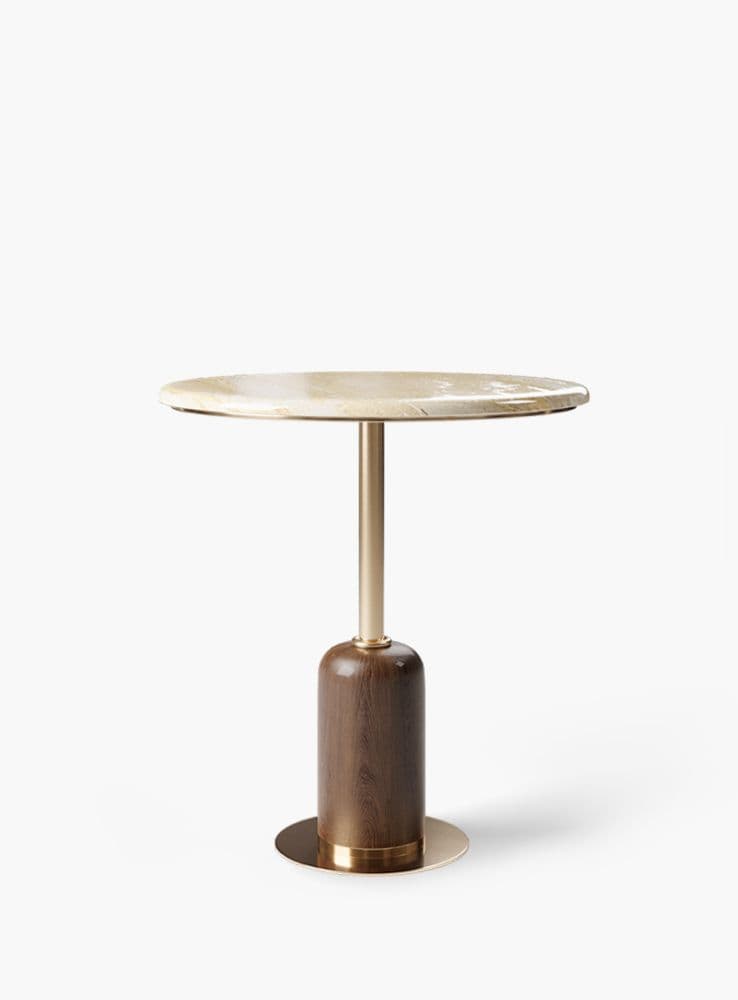 A modern side table featuring a circular light beige marble top, supported by a slender golden brass-finished metal post. The post connects to a cylindrical dark wood base, which is further stabilized by a flat, round brass plinth at the bottom. — 3D model
