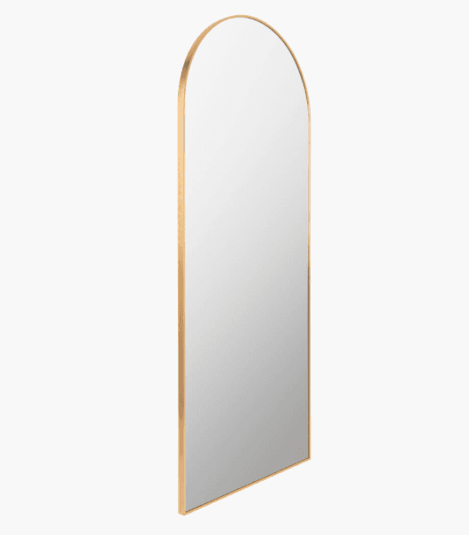 A tall, floor-standing mirror with a rounded top and a thin metallic frame. The reflective surface is a light grey color, indicating it is a mirror. The frame appears to be a polished gold or brass finish. — 3D model
